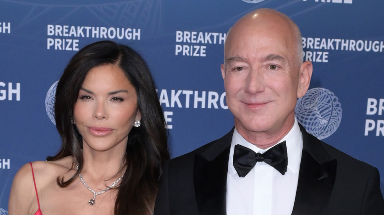 Jeff Bezos and Lauren Sanchez smiling at event