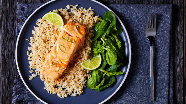 Salmon with brown rice, greens, and sauce
