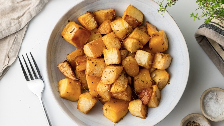 lemon roasted rutabaga in white bowl