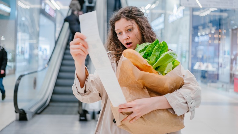 woman grocery receipt