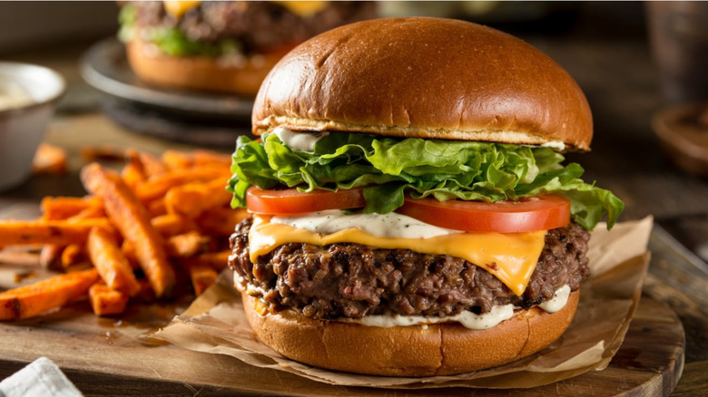 Loaded burger on a brioche bun with fries