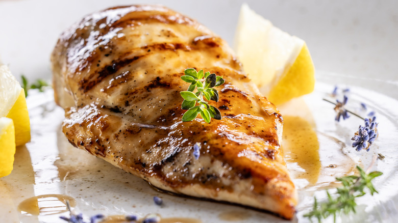 Grilled chicken breast on a decorative plate