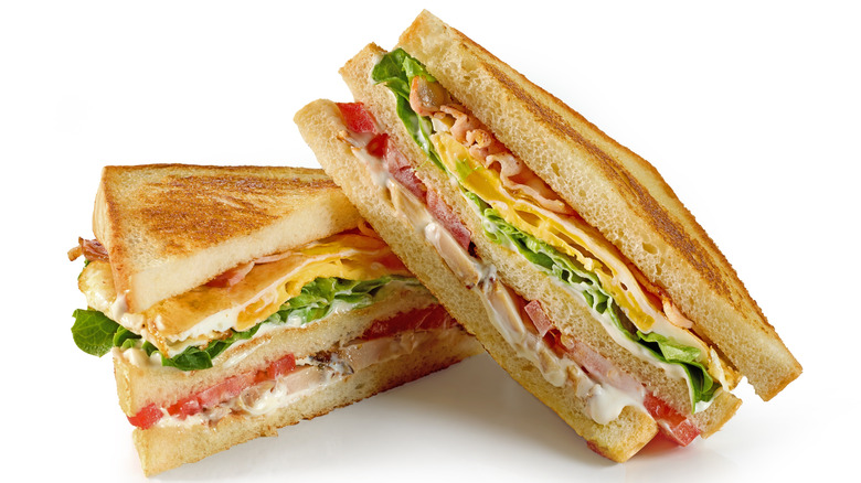 Close up of two halves of a club sandwich