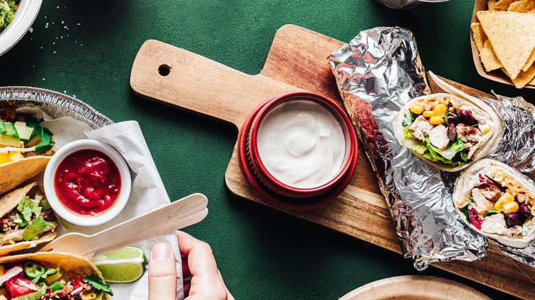 Burritos on wooden board