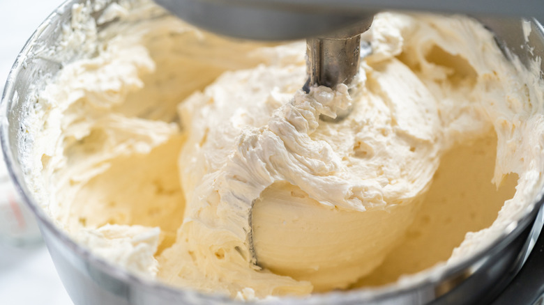 white frosting in a mixer