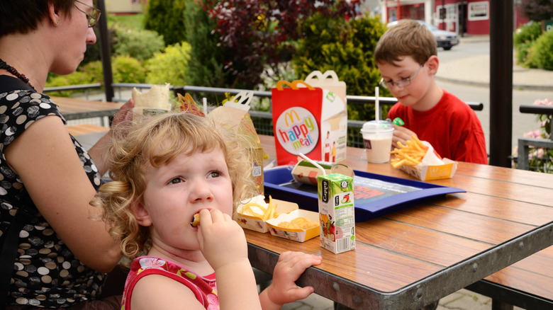 kids eating a McDonald's Happy Meal