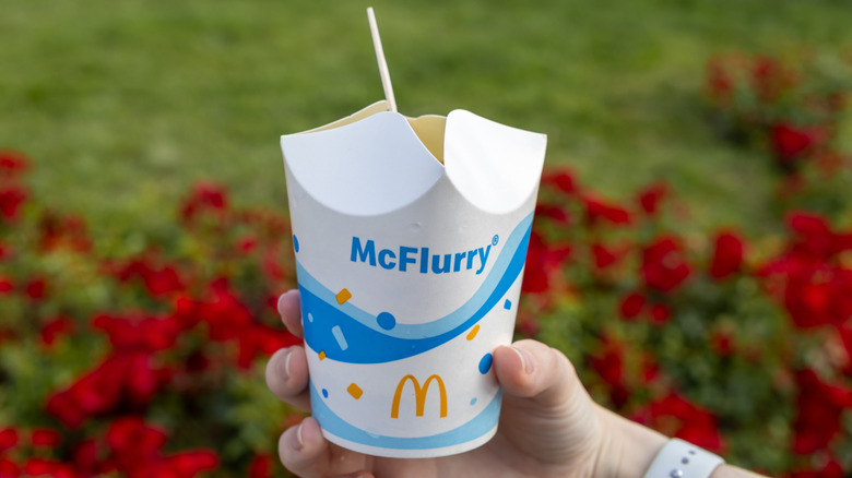 Hand holding McDonald's McFlurry