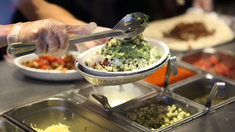 Chipotle worker preparing order