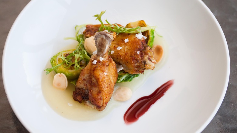 gastrique accompanying plated chicken wings