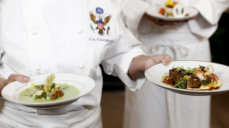Close-up of Comerford holding prepared dishes