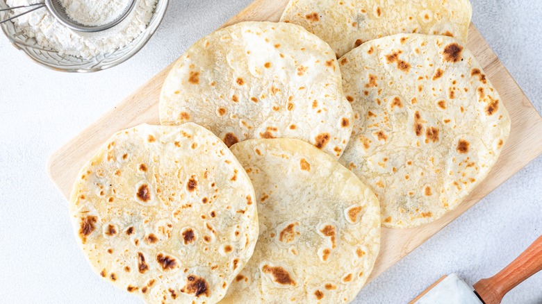 Tortillas on wooden board