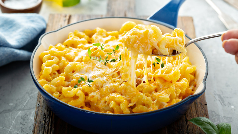 A cast iron pan full of macaroni and cheese