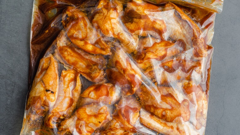 chicken marinating in bag