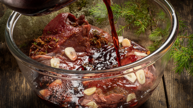 raw meat in bowl of marinade