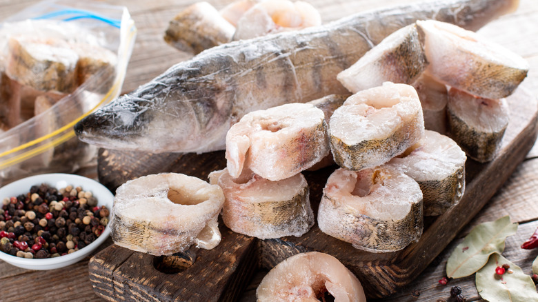 frozen fish on a cutting board