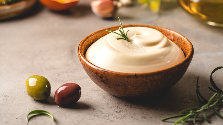 Small bowl of mayonnaise and olives 