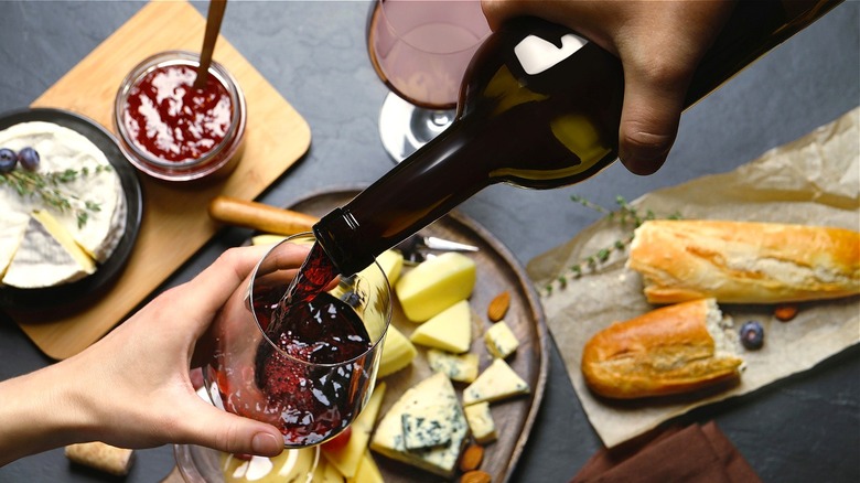 Wine poured into glass over food