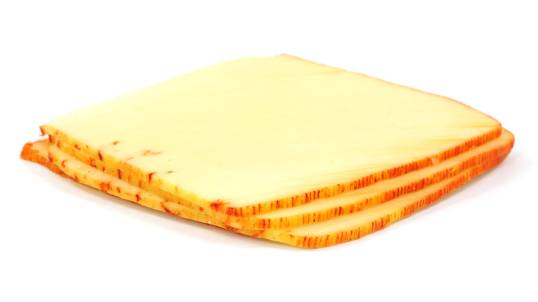 Muenster cheese slices stacked up