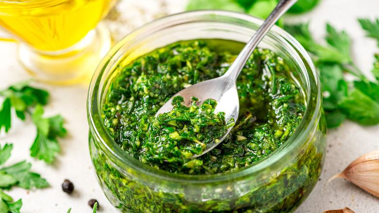 Chimichurri and spoon in jar