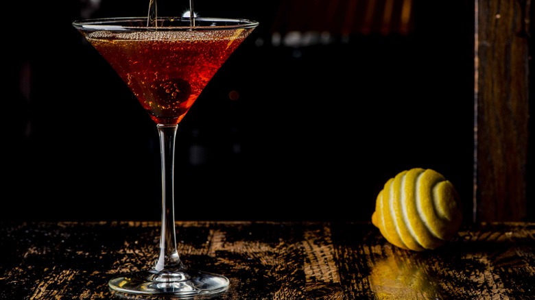 manhattan cocktail with lemon