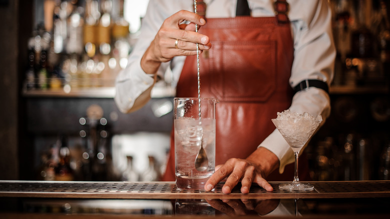 bartender stirring cocktail