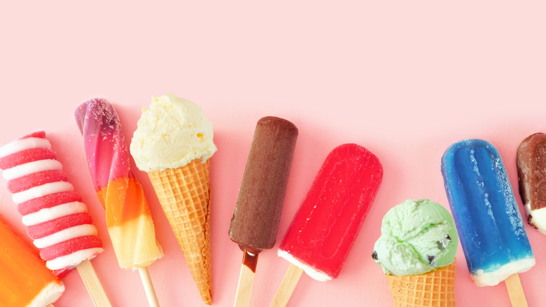 Assorted frozen desserts on a pink background
