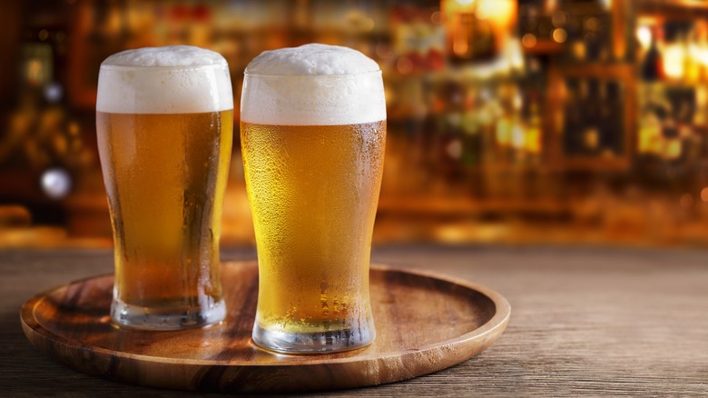 beer pints with frothy heads