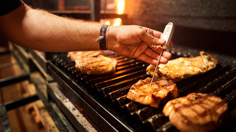 Chef temping meat