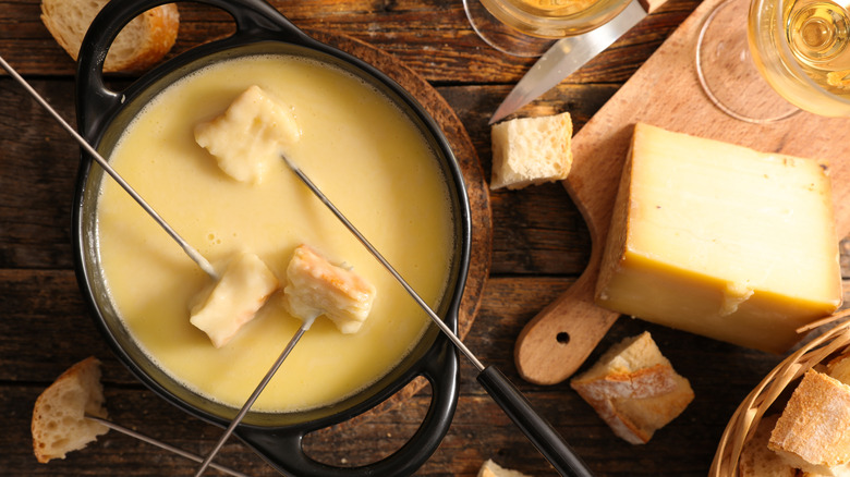 Bread cubes on forks in fondue