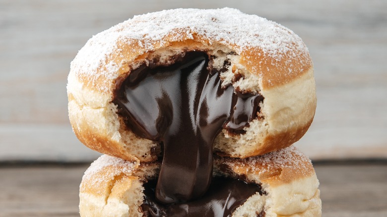 Two chocolate-filled donuts