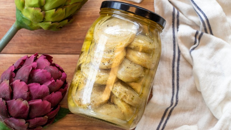 artichoke jar on wooden table