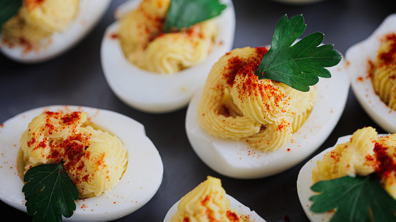 deviled eggs on black tray