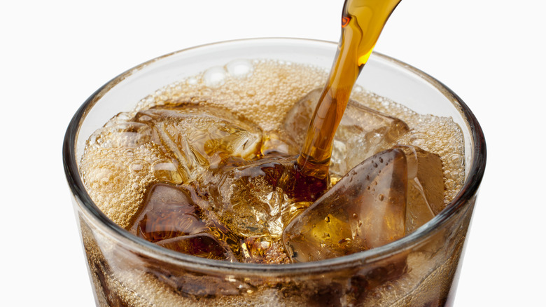 Soda poured in glass cup