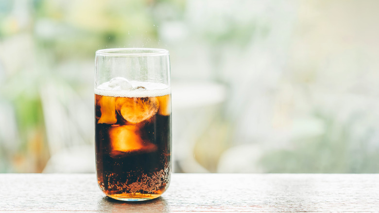 A glass of cola with ice