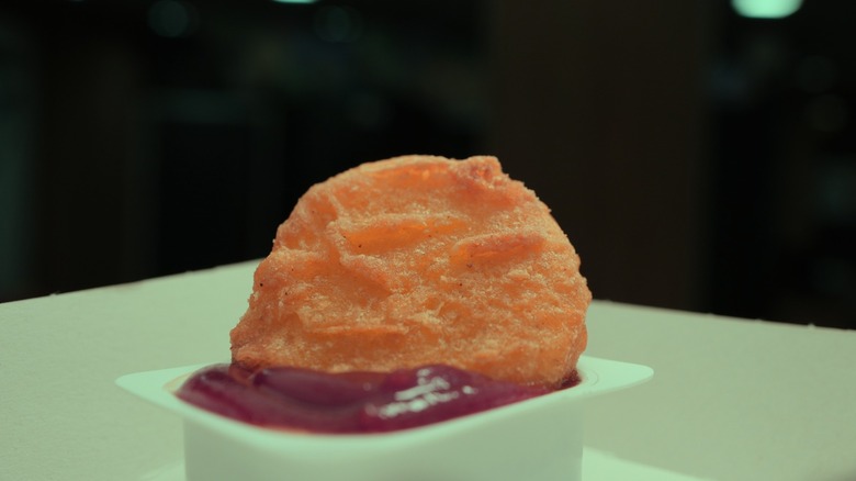 McNugget dipped into sauce