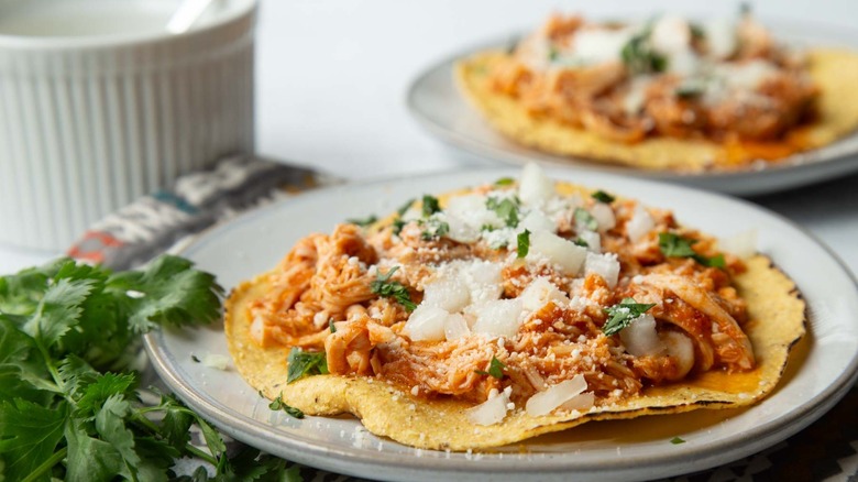 slow cooker chicken tinga on tostada