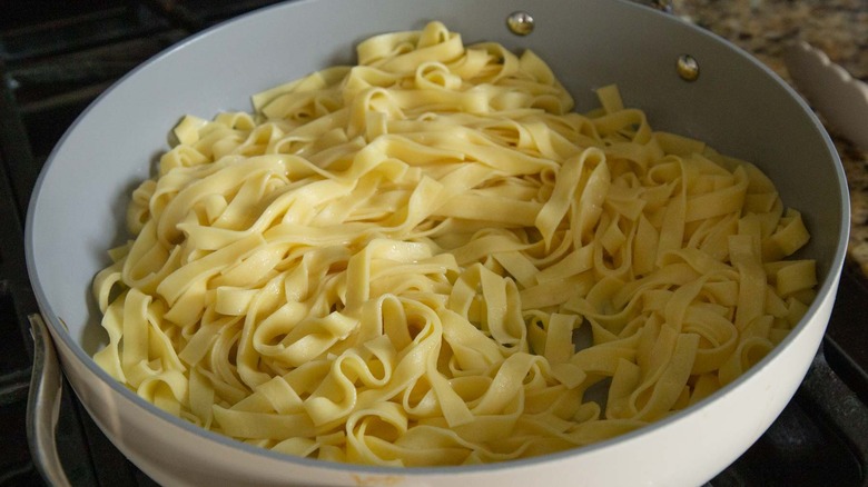 Tossing pasta in butter