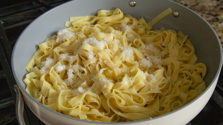 Pasta in pan with butter and Parmesan