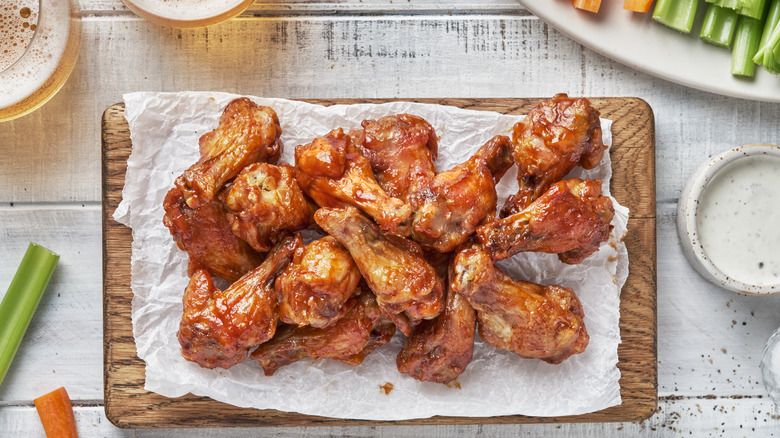 Close up of chicken wings on a board