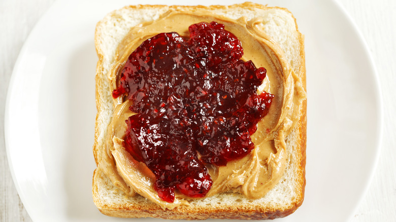 Peanut butter and jelly open on white bread