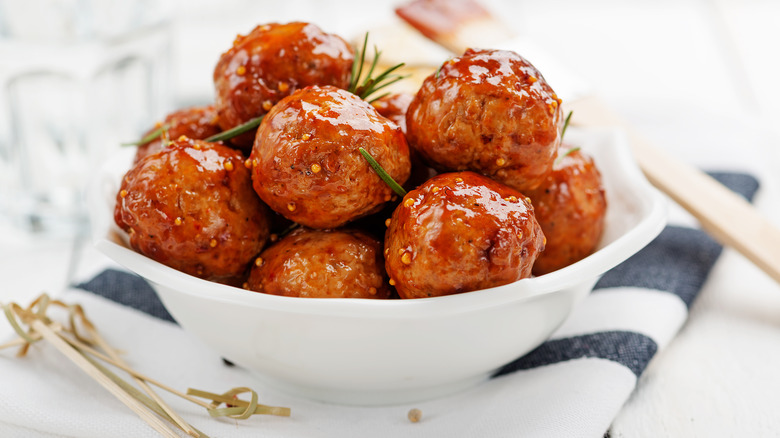 Glazed meatballs in white bowl