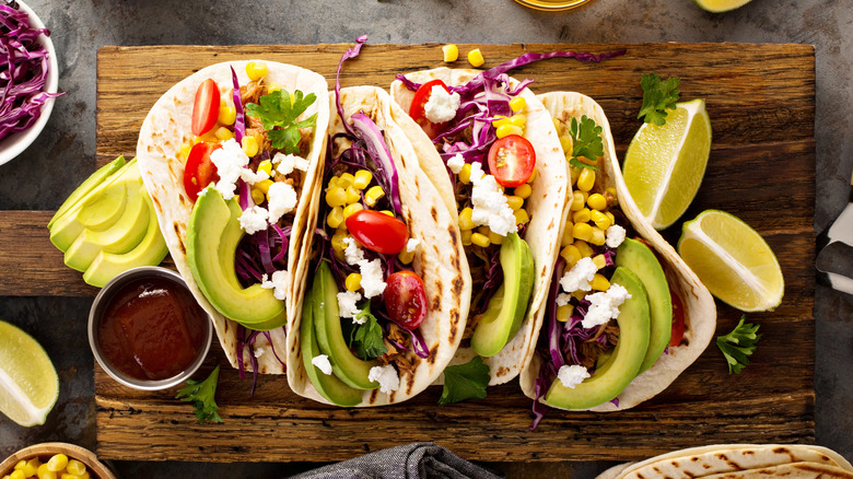 Tacos topped with corn