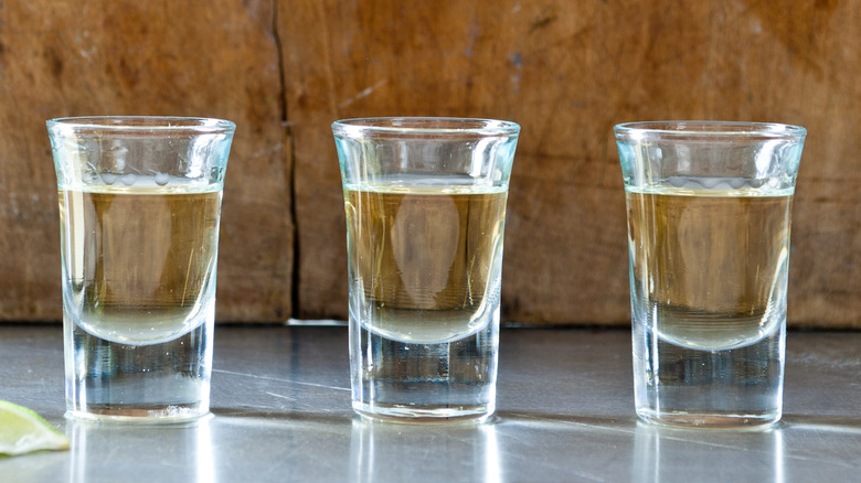 Line of tequila shots in a flight