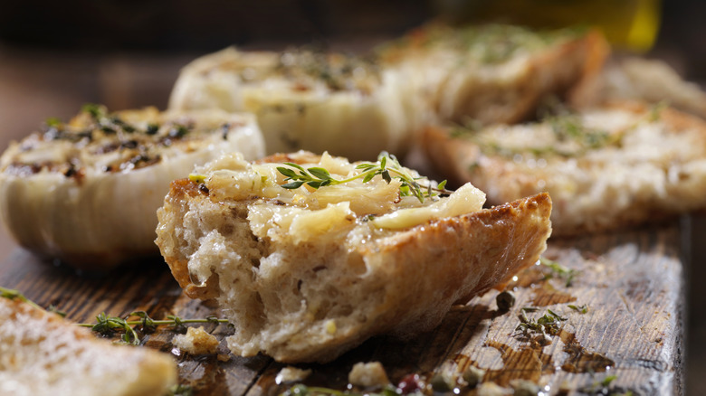 Garlic bread on wooden table