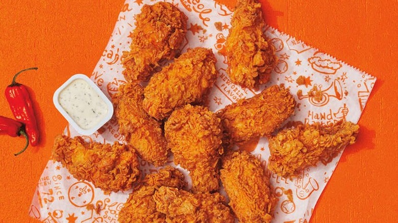 Wings with dipping sauce and peppers