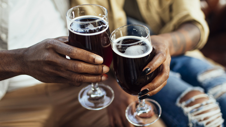 Toasting two glasses of beer