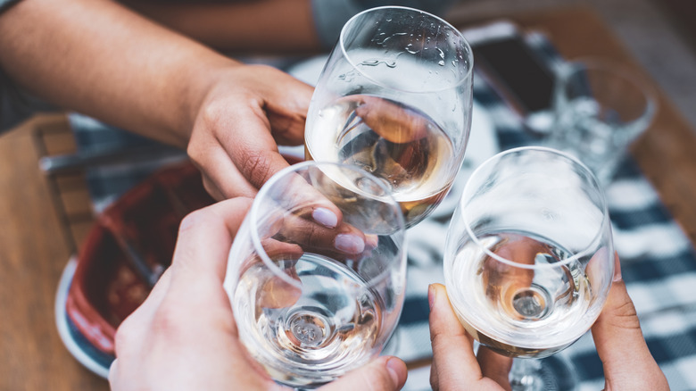 three glasses of white wine