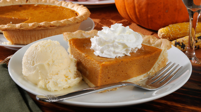 Slice of pumpkin pie and ice cream