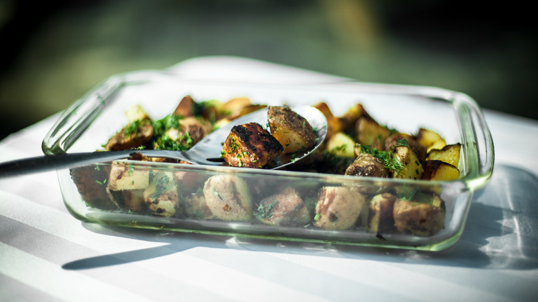 Roasted potatoes in glass baking dish