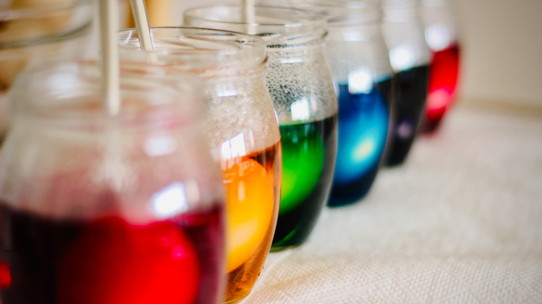 Lined-up jars of food coloring